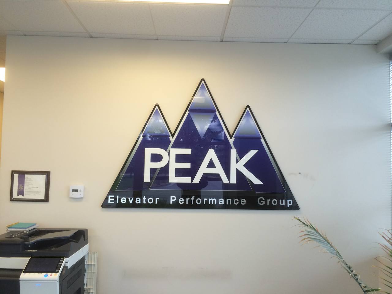 lobby sign installation Denver - PEAK Elevator Performance Group acrylic panel